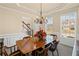 Traditional dining room featuring a wood table, chandelier, and natural light at 330 Meadowcrest Cir, Canton, GA 30115