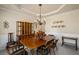 Bright dining room with a wooden table, china cabinet and decorative wall plates at 330 Meadowcrest Cir, Canton, GA 30115