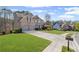 Attractive home featuring a well-maintained lawn, a two-car garage, and traditional brickwork at 330 Meadowcrest Cir, Canton, GA 30115