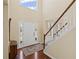 Grand two-story foyer with staircase, hardwood floors, and plenty of natural light at 330 Meadowcrest Cir, Canton, GA 30115