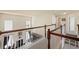 Upstairs hallway with hardwood railings and carpet at 330 Meadowcrest Cir, Canton, GA 30115