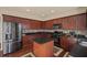 Stylish kitchen with stainless steel appliances, center island, and dark cabinetry at 330 Meadowcrest Cir, Canton, GA 30115