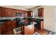 Well-equipped kitchen featuring granite countertops and dark wood cabinetry at 330 Meadowcrest Cir, Canton, GA 30115