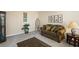 Comfortable living room with neutral walls, a patterned sofa, and decorative accents at 330 Meadowcrest Cir, Canton, GA 30115