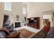 Bright living room features a fireplace, entertainment center and tall windows at 330 Meadowcrest Cir, Canton, GA 30115