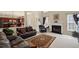 Cozy living room with a fireplace, leather furniture, and large windows at 330 Meadowcrest Cir, Canton, GA 30115