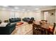Large living room with comfortable seating, area rug, and adjacent dining area at 330 Meadowcrest Cir, Canton, GA 30115