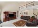 Open-concept living room with a balcony, large entertainment center, and comfortable seating at 330 Meadowcrest Cir, Canton, GA 30115