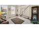 Cozy living room with large windows, plush carpeting, and views to the entrance hall at 330 Meadowcrest Cir, Canton, GA 30115