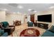 Basement living room with a large TV, a dining table, and comfortable seating area at 330 Meadowcrest Cir, Canton, GA 30115