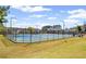 Well-maintained community tennis courts with lighting and fencing for recreation and competition at 330 Meadowcrest Cir, Canton, GA 30115