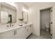 Bright bathroom featuring double vanity with modern fixtures and elegant hexagon tile flooring at 6055 Tattnall Overlook, Acworth, GA 30101