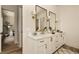 Elegant bathroom with double vanity, white cabinets, and decorative mirrors at 6055 Tattnall Overlook, Acworth, GA 30101