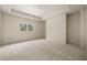 Spacious bedroom with neutral carpet, tray ceiling, and natural light from the window at 6055 Tattnall Overlook, Acworth, GA 30101