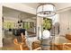 Open concept dining room featuring sleek lighting and an open staircase at 6055 Tattnall Overlook, Acworth, GA 30101