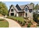 Beautiful two-story home with manicured lawn and inviting entryway at 6055 Tattnall Overlook, Acworth, GA 30101