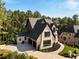 Stunning two-story home with a three-car garage and well-manicured landscaping at 6055 Tattnall Overlook, Acworth, GA 30101