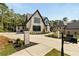 This beautiful brick home has a well-manicured lawn, and a circular driveway, adding to its curb appeal and charm at 6055 Tattnall Overlook, Acworth, GA 30101