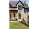Close-up of charming brick house front with arched door at 6055 Tattnall Overlook, Acworth, GA 30101