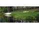 Scenic view of the golf course featuring lush greens and a serene lake at 6055 Tattnall Overlook, Acworth, GA 30101
