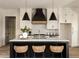 Bright kitchen featuring a large island with seating, modern appliances, and ample counter space at 6055 Tattnall Overlook, Acworth, GA 30101