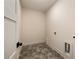 Functional laundry room with stylish hexagon tile flooring and utility connections at 6055 Tattnall Overlook, Acworth, GA 30101