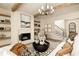 Cozy living room featuring a fireplace, wooden beams, and staircase, perfect for Gathering gatherings at 6055 Tattnall Overlook, Acworth, GA 30101