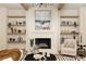 Elegant living room featuring a fireplace, floating shelves, and stylish decor for a cozy ambiance at 6055 Tattnall Overlook, Acworth, GA 30101