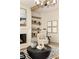 Bright living room showcasing a fireplace, stylish armchair, and decorative elements for a comfortable setting at 6055 Tattnall Overlook, Acworth, GA 30101