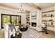 Inviting living room with fireplace, wood beams, and natural light at 6055 Tattnall Overlook, Acworth, GA 30101