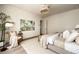 Bright and airy main bedroom with natural light, neutral decor, and hardwood flooring at 6055 Tattnall Overlook, Acworth, GA 30101