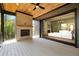 Stylish outdoor patio with brick fireplace and sliding glass doors lead to the home's main living area at 6055 Tattnall Overlook, Acworth, GA 30101