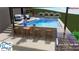 The pool includes a tanning ledge and seating near the bar, creating the perfect spot to enjoy a beverage and relax poolside at 6055 Tattnall Overlook, Acworth, GA 30101