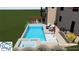 This aerial view captures a stunning pool area with a spa, tanning ledge, and inviting lounge, offering an oasis of relaxation at 6055 Tattnall Overlook, Acworth, GA 30101