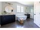 Modern bathroom with freestanding tub, sleek vanities, and elegant fixtures at 64 Telfair Ct, Acworth, GA 30101