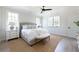 Bright bedroom featuring large windows, a ceiling fan, and neutral decor at 64 Telfair Ct, Acworth, GA 30101
