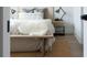 Cozy bedroom featuring a wooden headboard, neutral bedding, and rustic nightstand at 64 Telfair Ct, Acworth, GA 30101