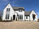 Beautiful two-story home with painted brick, covered porch, and manicured front yard at 64 Telfair Ct, Acworth, GA 30101