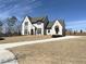 Beautiful two-story home with manicured front lawn and a large driveway at 64 Telfair Ct, Acworth, GA 30101