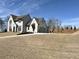Wide driveway leads to a two car garage attached to this two-story home at 64 Telfair Ct, Acworth, GA 30101