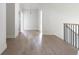 Bright hallway features hardwood floors, neutral walls, and modern lighting at 64 Telfair Ct, Acworth, GA 30101