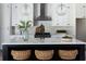 Bright kitchen featuring a center island, white cabinets, and modern pendant lighting at 64 Telfair Ct, Acworth, GA 30101