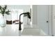 Modern black faucet over a white kitchen sink and countertop at 64 Telfair Ct, Acworth, GA 30101