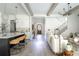 Open-concept living room showcases hardwood floors, beamed ceilings, and natural light at 64 Telfair Ct, Acworth, GA 30101