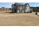 Back exterior with covered patio & lush backyard, set in an established community at 64 Telfair Ct, Acworth, GA 30101