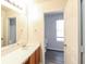 Bright bathroom features a large mirror and single vanity providing a functional and clean space at 844 Glenshire Ct, Riverdale, GA 30274
