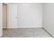 This bedroom features neutral walls, plush carpet, and a doorway leading to other rooms at 844 Glenshire Ct, Riverdale, GA 30274