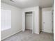 Comfortable bedroom with plush carpeting, closet and large window offering ample storage and light at 844 Glenshire Ct, Riverdale, GA 30274