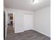 This bedroom offers neutral walls, wood flooring and doorways leading to other rooms at 844 Glenshire Ct, Riverdale, GA 30274