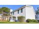 Charming two-story home with light blue siding and a well-maintained front yard with lush greenery at 844 Glenshire Ct, Riverdale, GA 30274